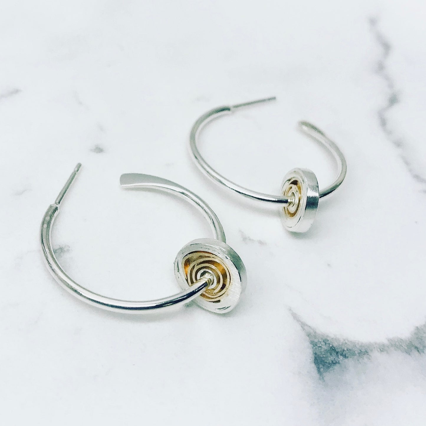 Spiral hoop earrings, matt silver with 18ct gold