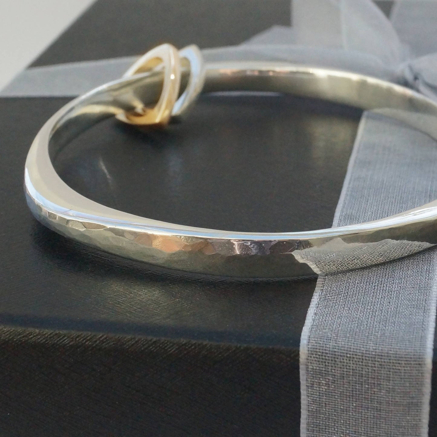 Silver Wide Flow bangle with triangle charms