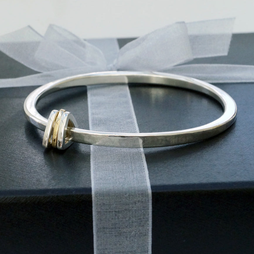 Oval Bangle with Triangle Charms