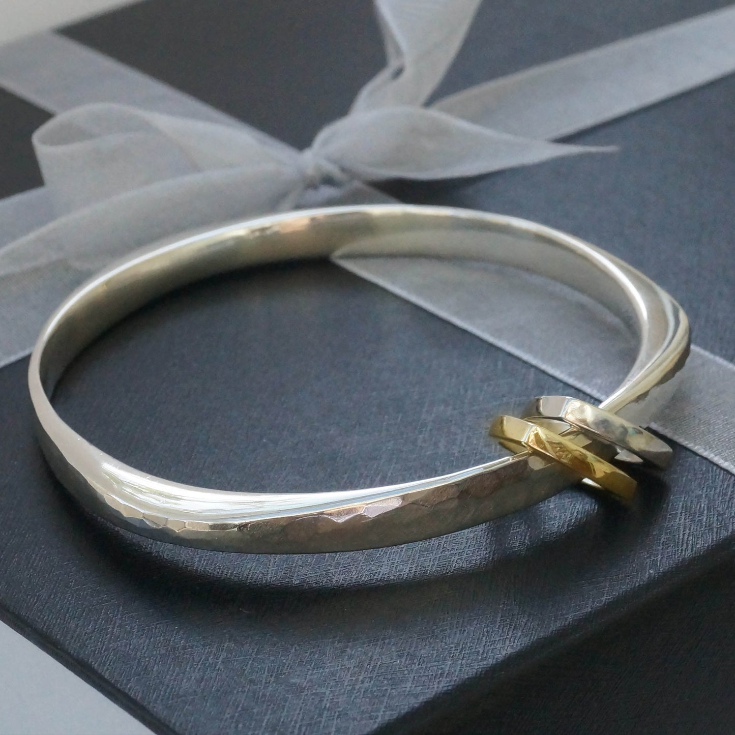 Hand hammered bangle silver with triangular charms