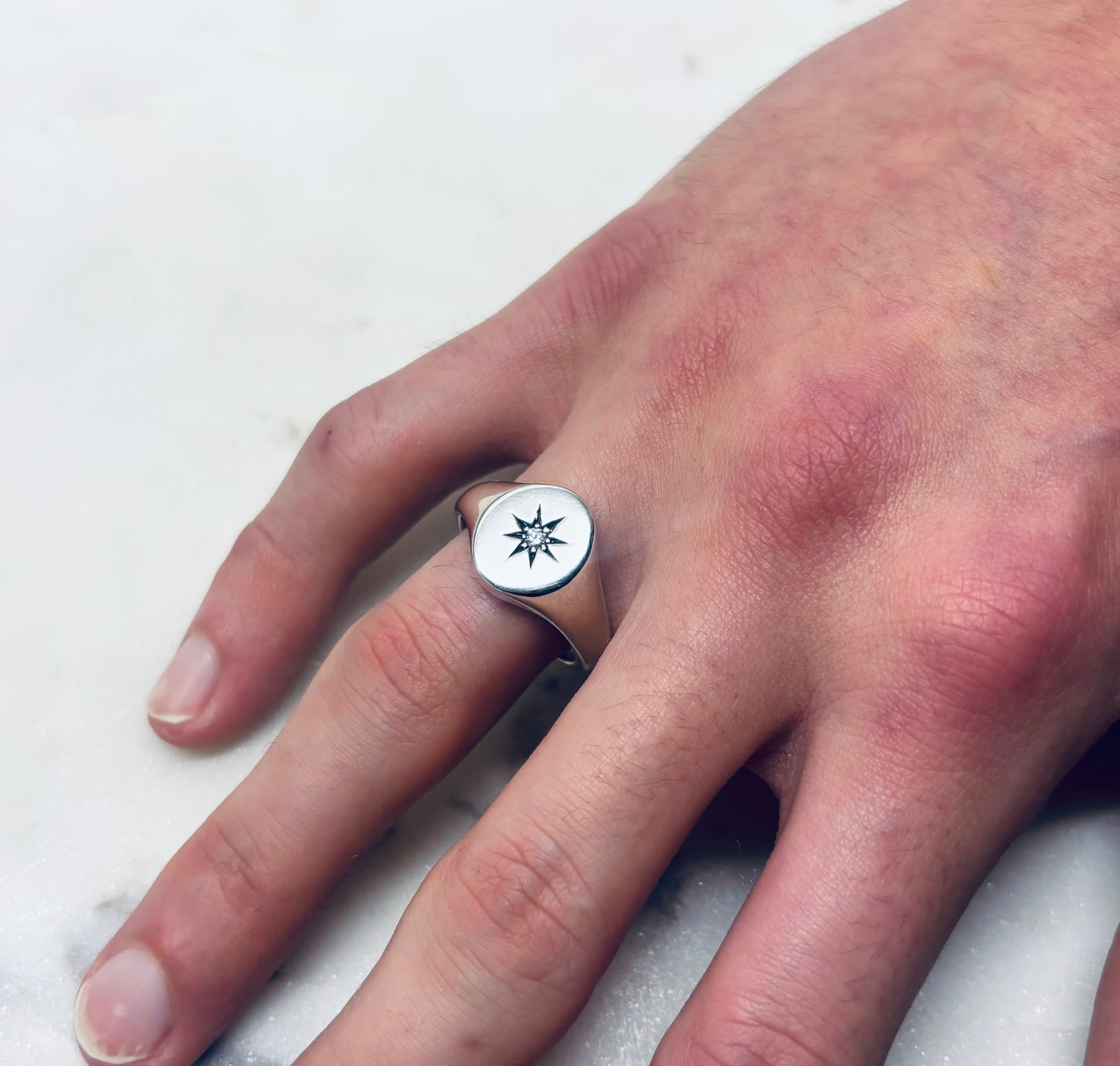 Oval star set diamond signet ring