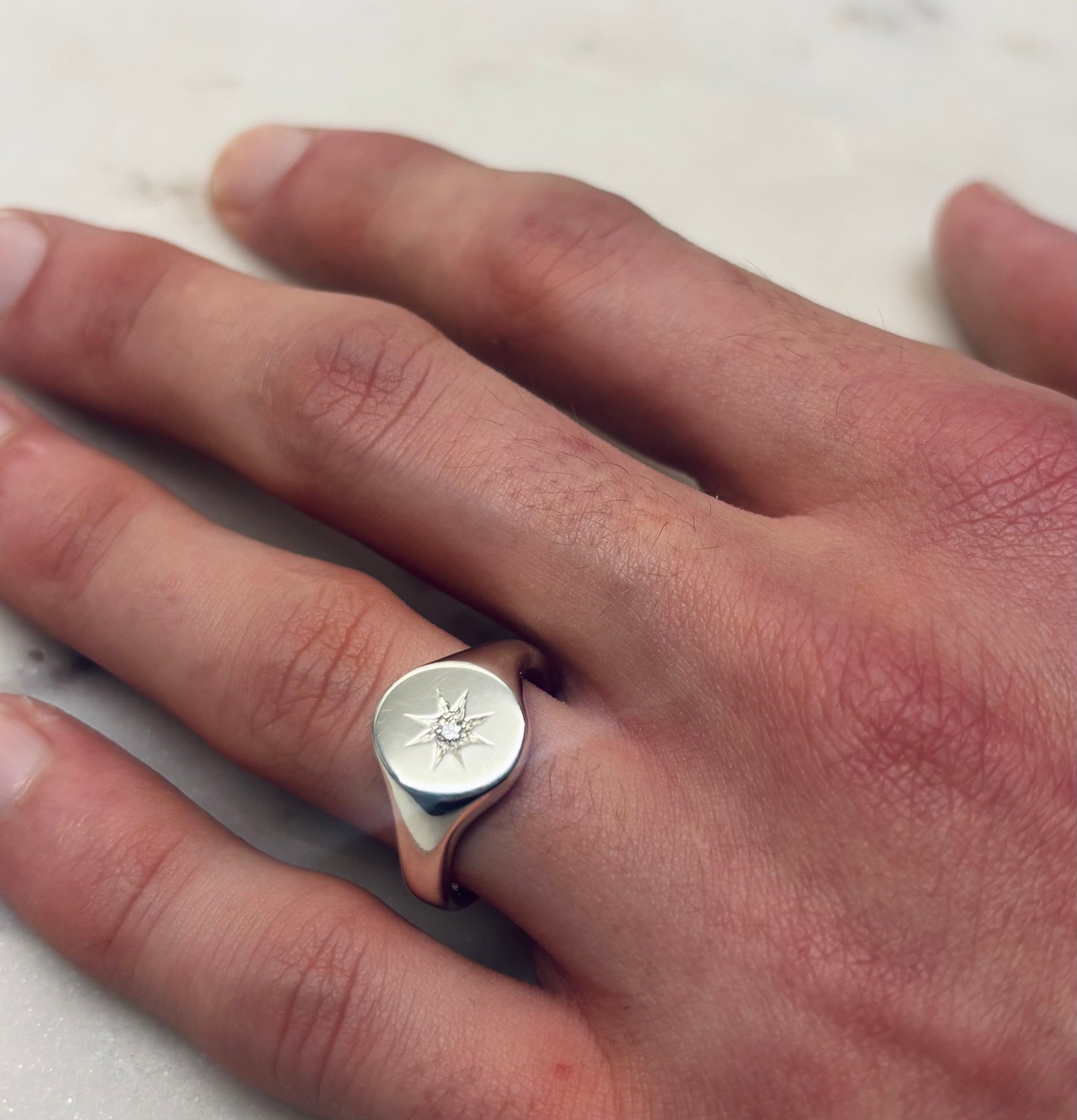 Oval star set diamond signet ring