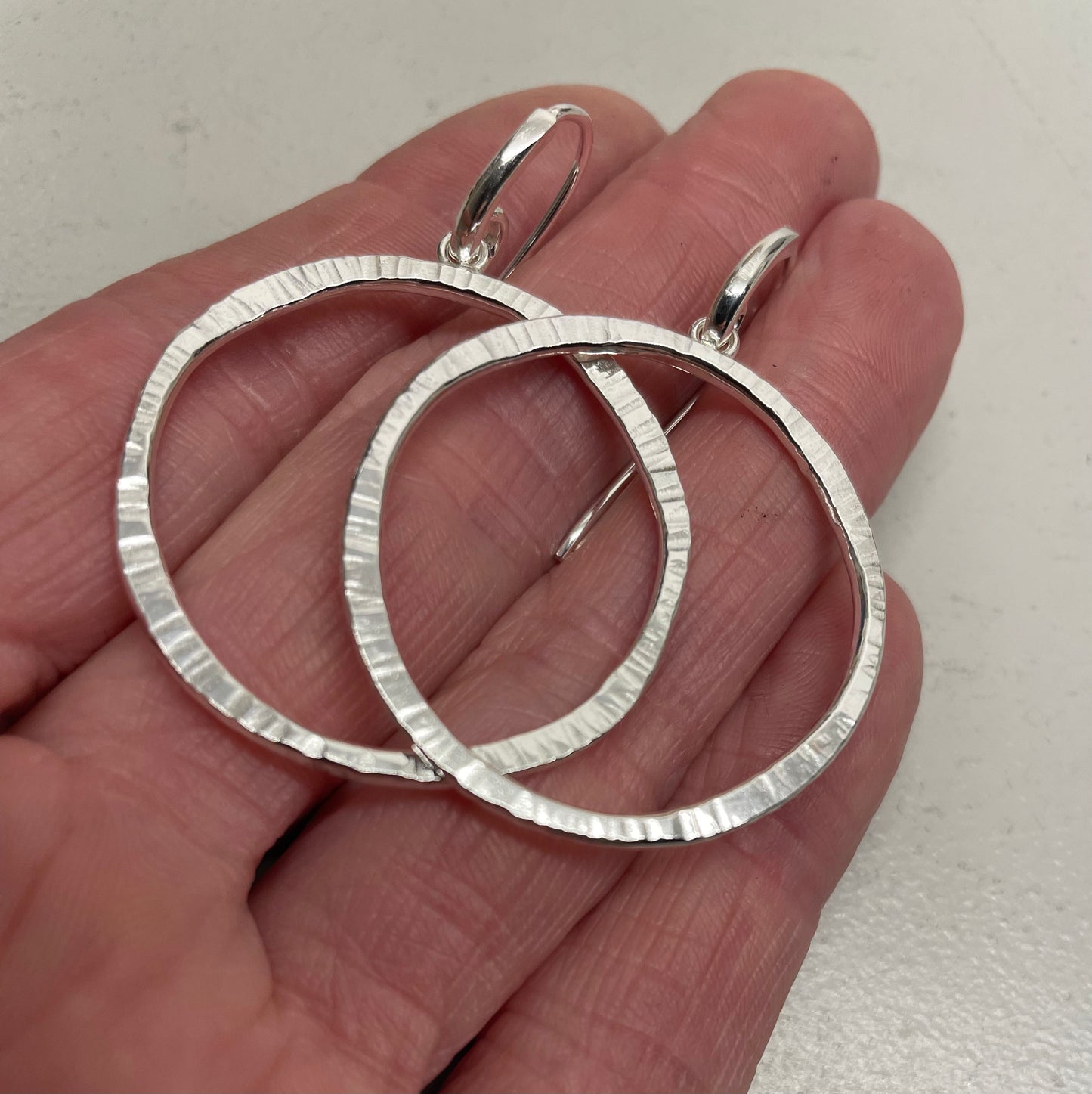 Solar circle drop earrings